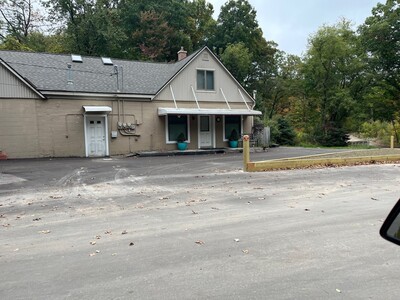 An informational meeting being held regarding the cleanup at a former Dexter Township business