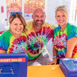 Three people in a tie-dye shirt