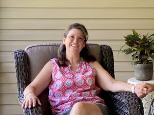 woman sitting in porch chair
