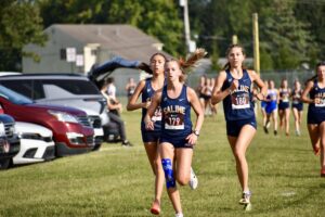 Saline Girls’ XC Cruises to Milan Puddle Jumper Title 