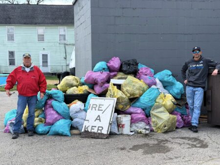 Milan Cares Volunteers Push Through Rain for Spring Cleanup