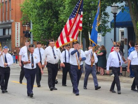 As Flags Fly and Bands March, Local Communities Pause to Remember the Fallen